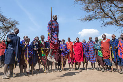 Group of people against the sky