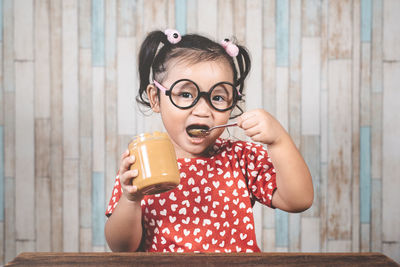 Portrait of a boy drinking coffee