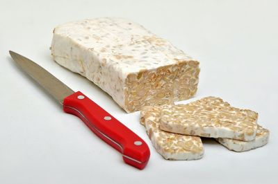 Close-up of pizza on white background