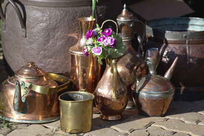 Close-up of various flowers in jar on table