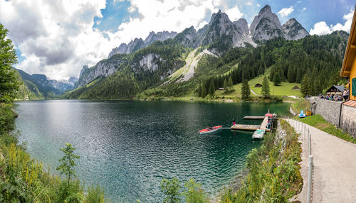 Scenic view of lake and mountains against sky