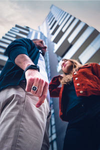 Low angle view of people standing outdoors