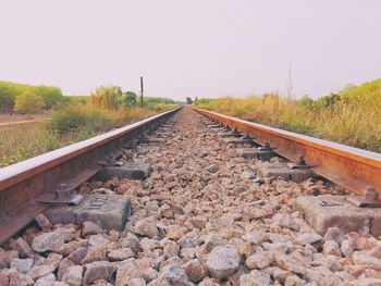 Railroad tracks against clear sky