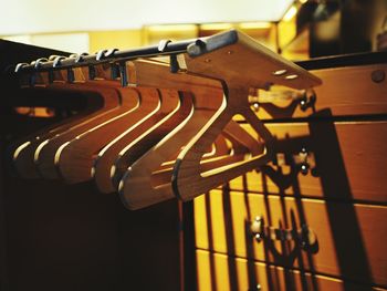 Close-up of piano hanging on wood