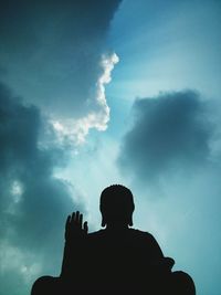 Low angle view of statue against sky