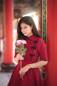 Young woman holding flower bouquet