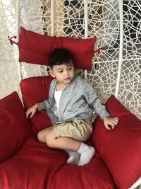 Cute boy relaxing on sofa