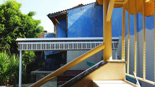 Staircase by building against sky