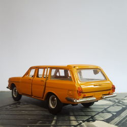 Yellow toy car against sky