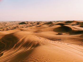 Scenic view of desert against clear sky