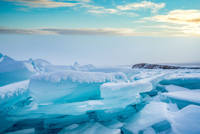 Scenic view of snow covered landscape against sky