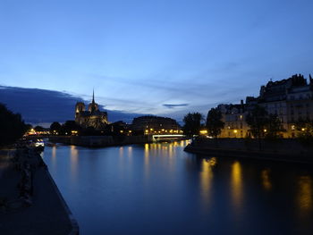 View of illuminated buildings at waterfront