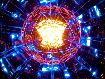 Low angle view of illuminated lights hanging from ceiling
