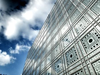 Low angle view of building against cloudy sky