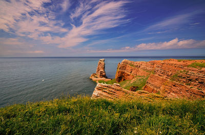 Scenic view of sea against cloudy sky