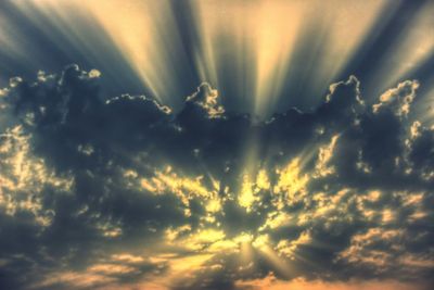 Sun shining through clouds