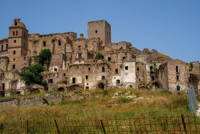 Old ruins against clear blue sky