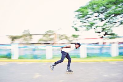 Full length of man skateboarding