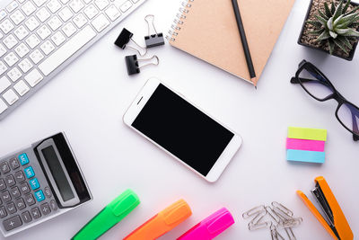 Directly above shot of various office supplies on table