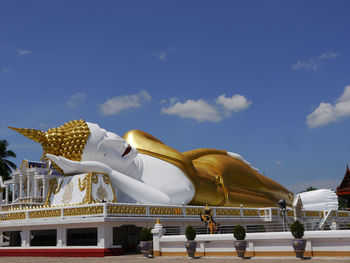 Statue against blue sky