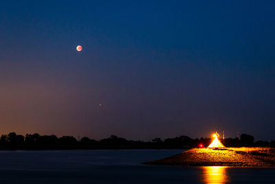 Scenic view of sea against sky at night