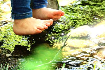 Low section of child over lake