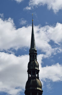 Low angle view of tower of building against cloudy sky