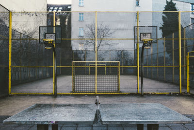 Table tennis by soccer field at park