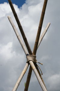 Low angle view of traditional windmill against sky