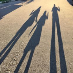 Shadow of people on street