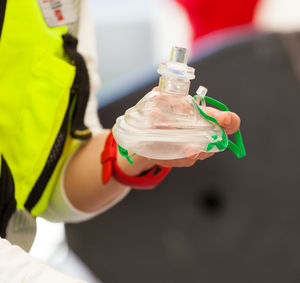 Close-up of hand holding bottle