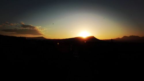 Scenic view of mountains at sunset