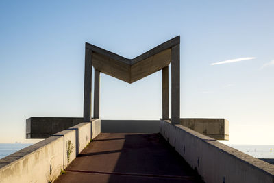 Cropped built structure against blue sky