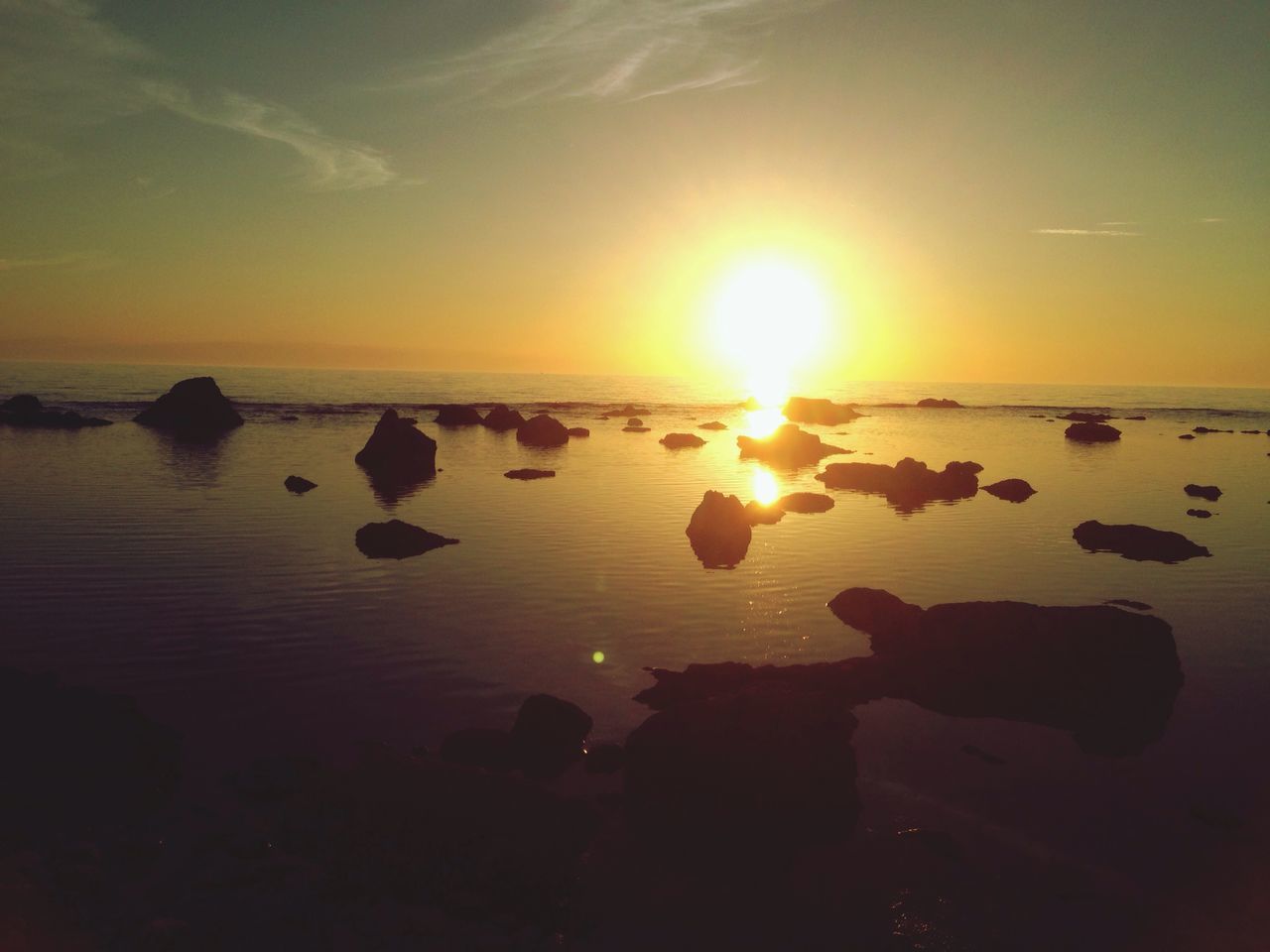 sunset, water, sea, orange color, sun, reflection, scenics, silhouette, beauty in nature, beach, horizon over water, tranquility, tranquil scene, nature, sky, leisure activity, lifestyles, shore, idyllic