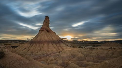 Scenic view of desert against sky during sunset
