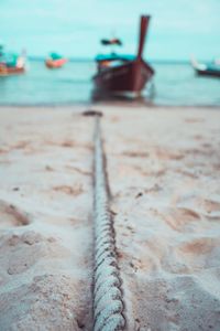 Rope on sand at beach