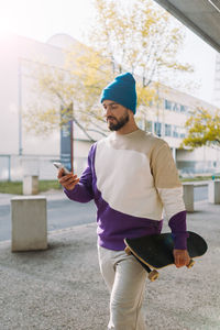 Side view of man standing in gym