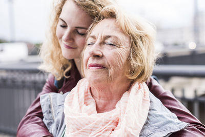 Portrait of senior woman with her granddaughter