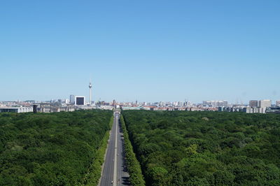 View of city against clear blue sky