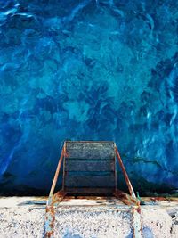 High angle view of ladder by sea