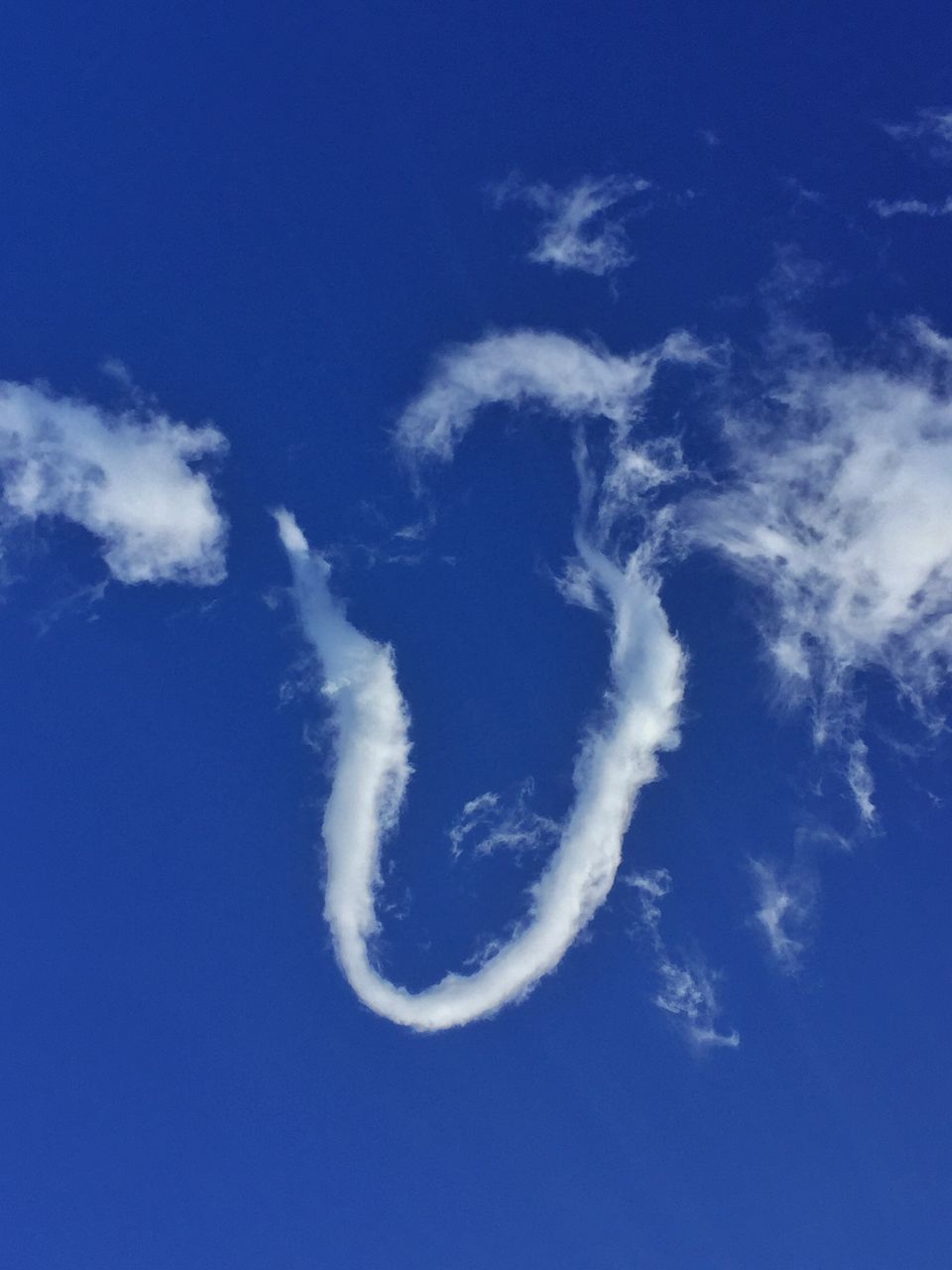 LOW ANGLE VIEW OF VAPOR TRAILS IN SKY