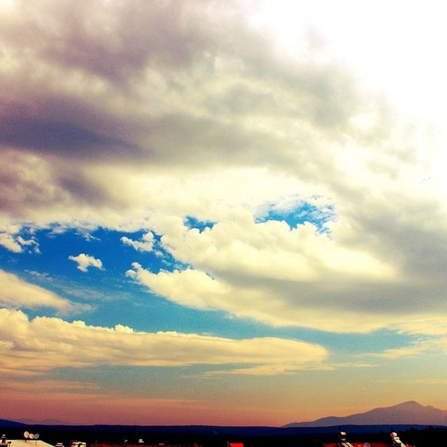 sky, cloud - sky, scenics, beauty in nature, tranquility, tranquil scene, cloudy, sunset, nature, cloud, cloudscape, idyllic, weather, sea, dramatic sky, overcast, outdoors, silhouette, dusk, water