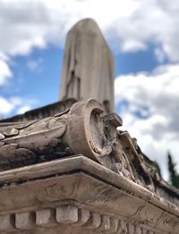 Low angle view of statue against sky