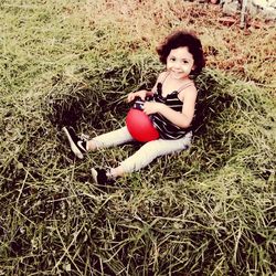 High angle portrait of young woman in field