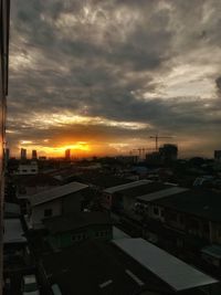 Cityscape against sky during sunset