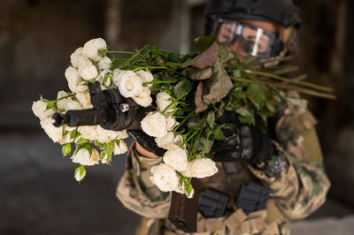 Cropped hand holding flowers