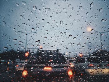Full frame shot of wet glass window in rainy season