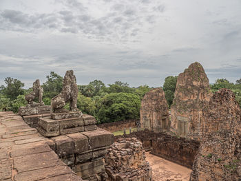 Old temple against cloudy sky