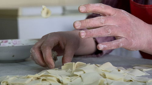 Midsection of person preparing food