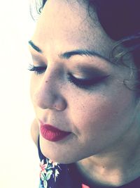 Close-up portrait of young woman with eyes closed